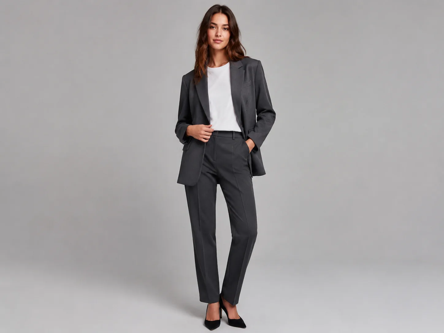 Virtual try-on still — blazer + tee + trousers on a studio model · illustrative · generated on SupaImagine